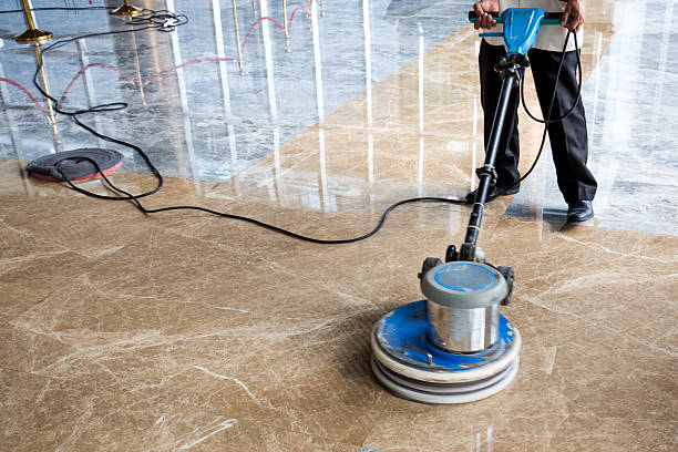 people polishes floor indoors plumbing-services