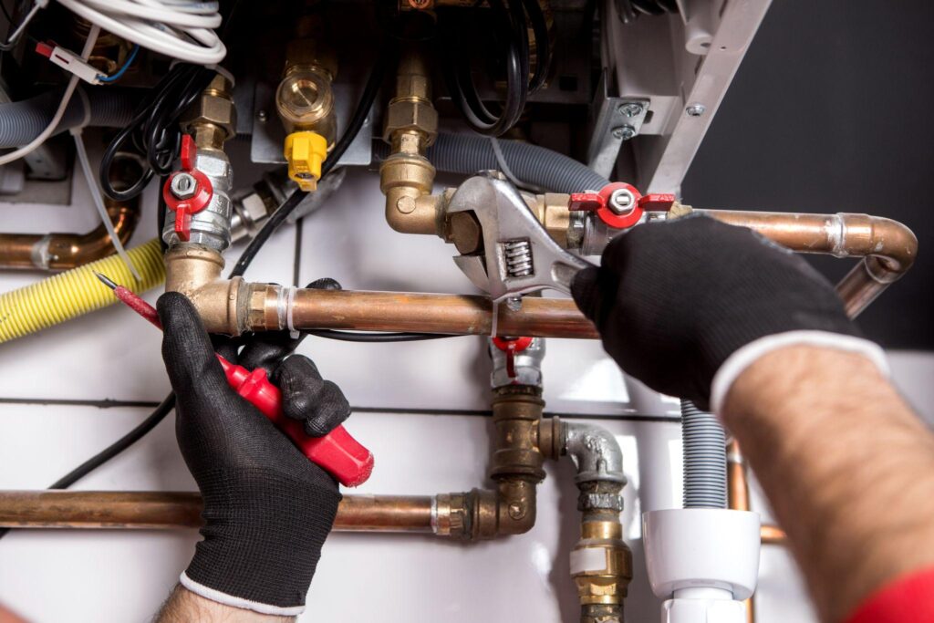 plumber-fixing-central-heating-Pipe repair and replacement. plumbing-services